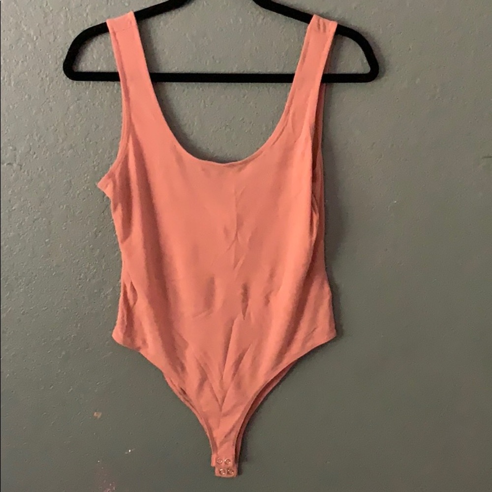 Pink body suit